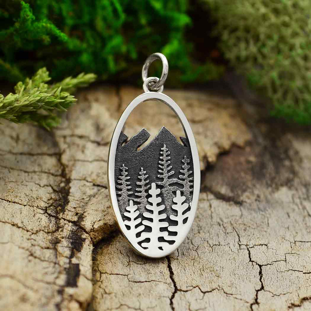 layered trees and mountains oval charm-4227
