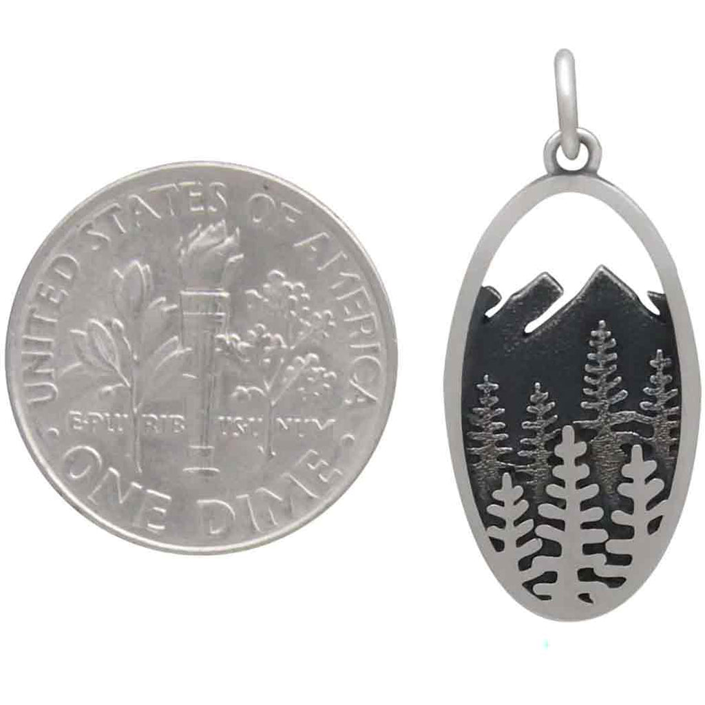 layered trees and mountains oval charm-4227